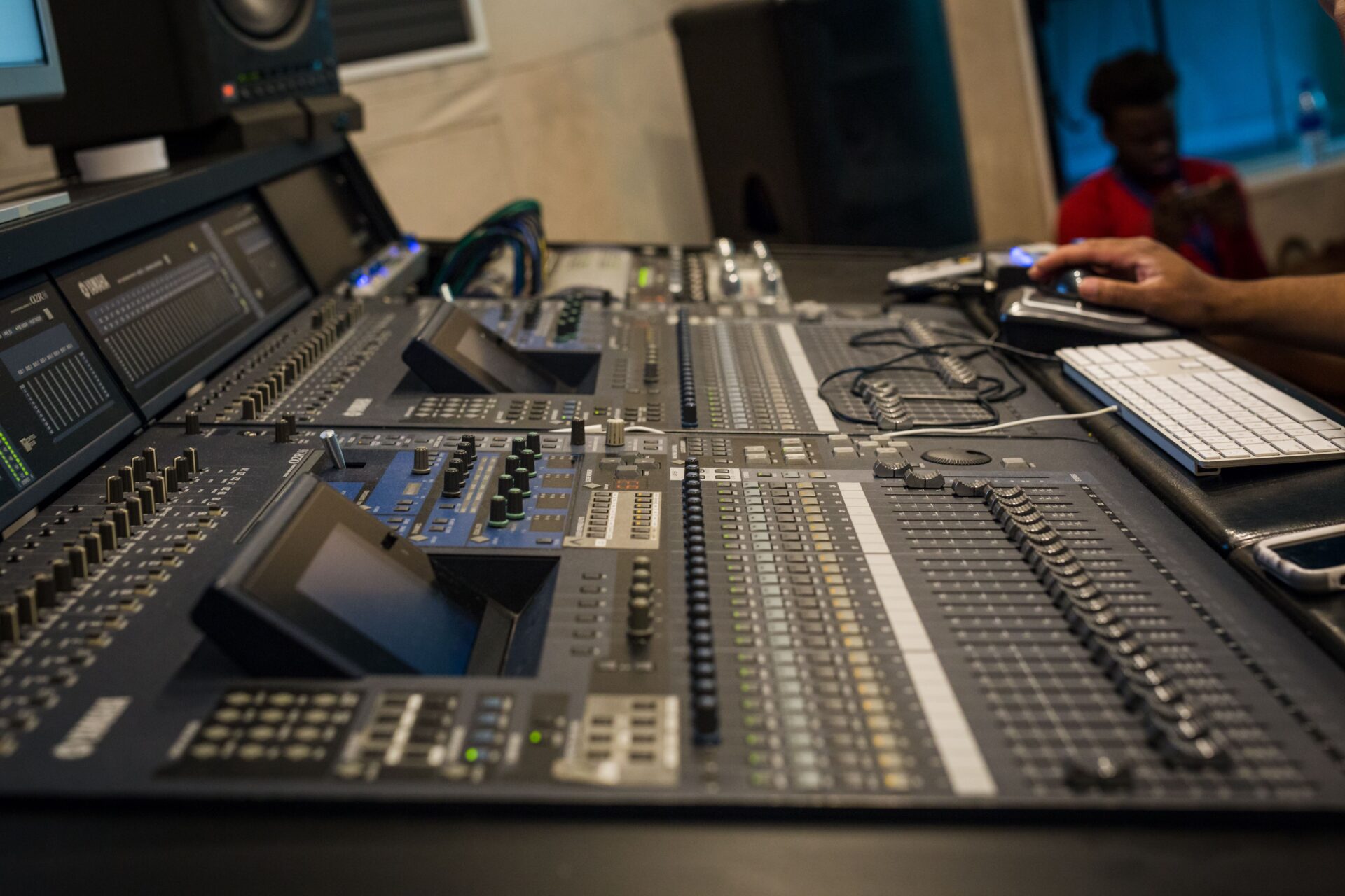 A person is working on some sound board